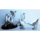 A Lladro Zodiac Collection porcelain figure modelled as a snake curled around a flowering branch,