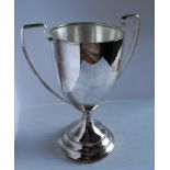 An Art Deco silver two-handled trophy cup on a stepped base by B&W Ltd., Birmingham, 1930, 16.5 cm
