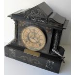 A Victorian slate and marble mantle clock with circular brass dial, Roman numerals, in working order