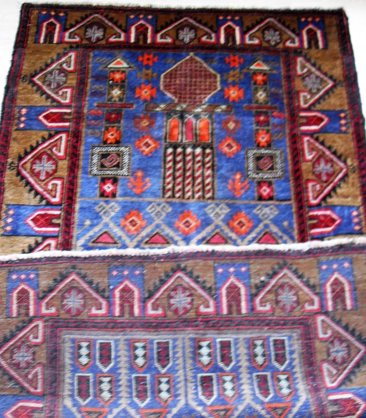 An Afghan hand-knotted Herathi Balochi blue-ground wool rug with multi coloured isometric designs, - Bild 2 aus 2