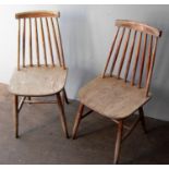 A pair of Ercol-style hardwood spindle-back kitchen chairs with 'H' stretcher supports