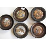 A selection of five wood-framed Prattware pot lids: 'The Village Wedding', 'The Snow Drift', '