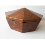 A Regency birds eye walnut octagonal sewing box with boxwood stringing and silk-lined interior,