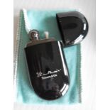 A Tiffany & Co. Elsa Peretti Bean Lighter in black lacquer. 2.5" high, unused in original