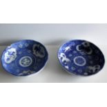 Two circular Oriental 19th century blue / white plates