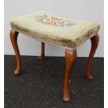 An Edwardian walnut-framed oblong dressing stool with original embroidered seat and cabriole legs,