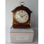 O. Comitti & Son, an Edwardian-style inlaid, broken arch mantle clock, boxed, as new