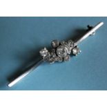 An early 20th century platinum-tested bar brooch with central cluster of old European cut