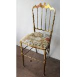 An Italian Chiavari brass side chair with padded seat, stamped Made In Italy.