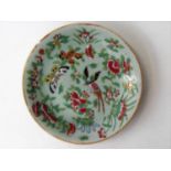 A 19th century Chinese celadon-ground Cantonese famille rose porcelain plate, 19 cm diameter with