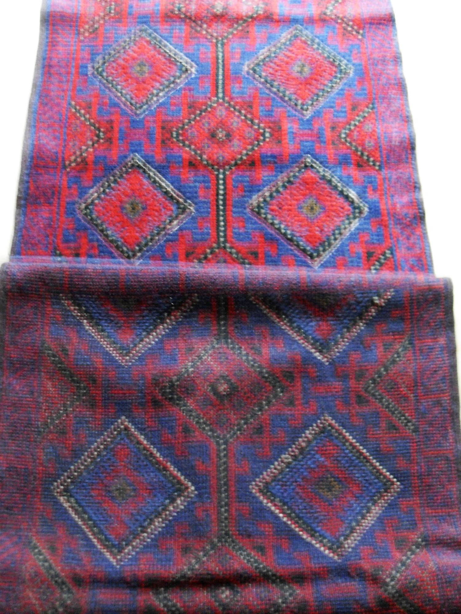An Afghan hand-knotted Meshwani blue-ground wool runner with multi-coloured lozenge designs, - Bild 2 aus 2