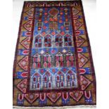 An Afghan hand-knotted Herathi Balochi blue-ground wool rug with multi coloured isometric designs,