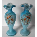 A pair of 19th century turquoise Moser-style glass vases with wavy rims and multicoloured floral
