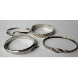 Four silver bangles, each boxed (4)