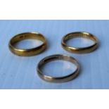 Two 22ct yellow gold wedding bands 11.17g and a 9ct yellow gold wedding band, 2.02g, all