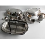 An assortment of silver plated table and flat ware to include a pair of Harrods oval food warmers,