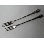 A cased silver pickle fork, Sheffield 1964 and another silver plate (2)