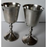 A pair of silver goblets, each with a baluster stem on a spreading foot by Deakin & Francis Ltd,