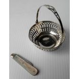 A sterling silver bon-bon basket and a George V silver and mother-of-pearl fruit knife, Sheffield