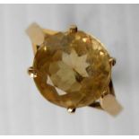 An 18ct yellow gold round-cut citrine ring mounted in a cage setting, size L 1/2 with matching
