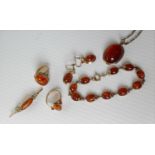 A 9ct yellow gold and amber parure comprising cabochon (25 x 15 x 10mm approximately) pendant with