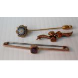 Two 9ct yellow gold brooches, one amethyst set and a stick pin with floral-inset decoration,.
