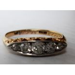 A George V five graduated old-cut diamond ring on an 18ct yellow gold band, size P, hallmarked, 2.