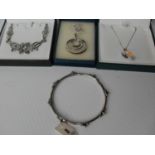 Three silver necklaces, one set with a crystal drop and a silver bangle set, all boxed (3)