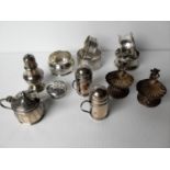 An array of five mostly late Victorian / Edwardian silver napkin rings, mixed dates and a