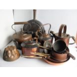 As assortment of brass and copper ware to include watering can, jelly moulds, etc