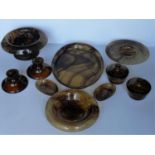 A selection of ten George Davidson glass, in cloudy amber, trays bowls, etc. Minor chips to large