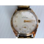 A 1960s Garrard gentleman’s 9ct gold dress watch, the silvered dial with applied gold Arabic