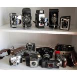 An assortment of vintage cameras to include a no. 2 folding autographic brownie; Kodak Duaflex;