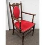 An Edwardian mahogany carver armchair with fabric upholstered support and seat raised on cabriole