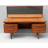 A 1970s G-Plan teak wood dressing table in the manner of Mogens Kolo. The dressing table raised on
