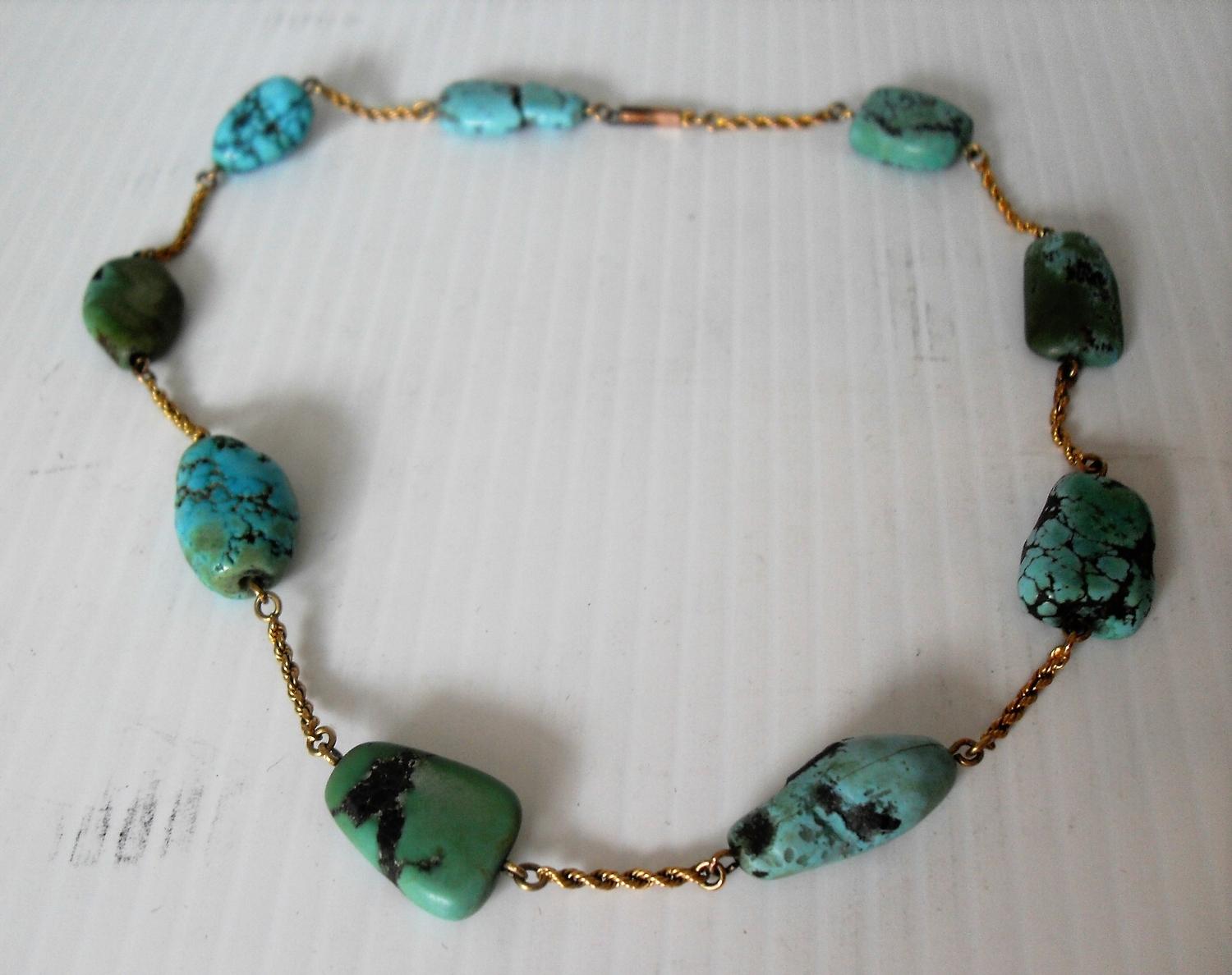 A turquoise beaded necklace on a 9ct gold chain, 37cm