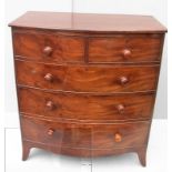 A Georgian mahogany bow-fronted chest of two short and three long graduated drawers on splayed feet,