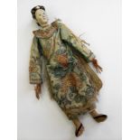 A late 19th century articulated carved ceramic and wood Chinese female doll with painted features,