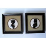 H. C. Bassett, a pair of reverse on domed glass portrait silhouettes of a lady and gentleman