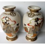 A pair of late 19th early 20th century Japanese vases of baluster form, 32 cm H without damage or