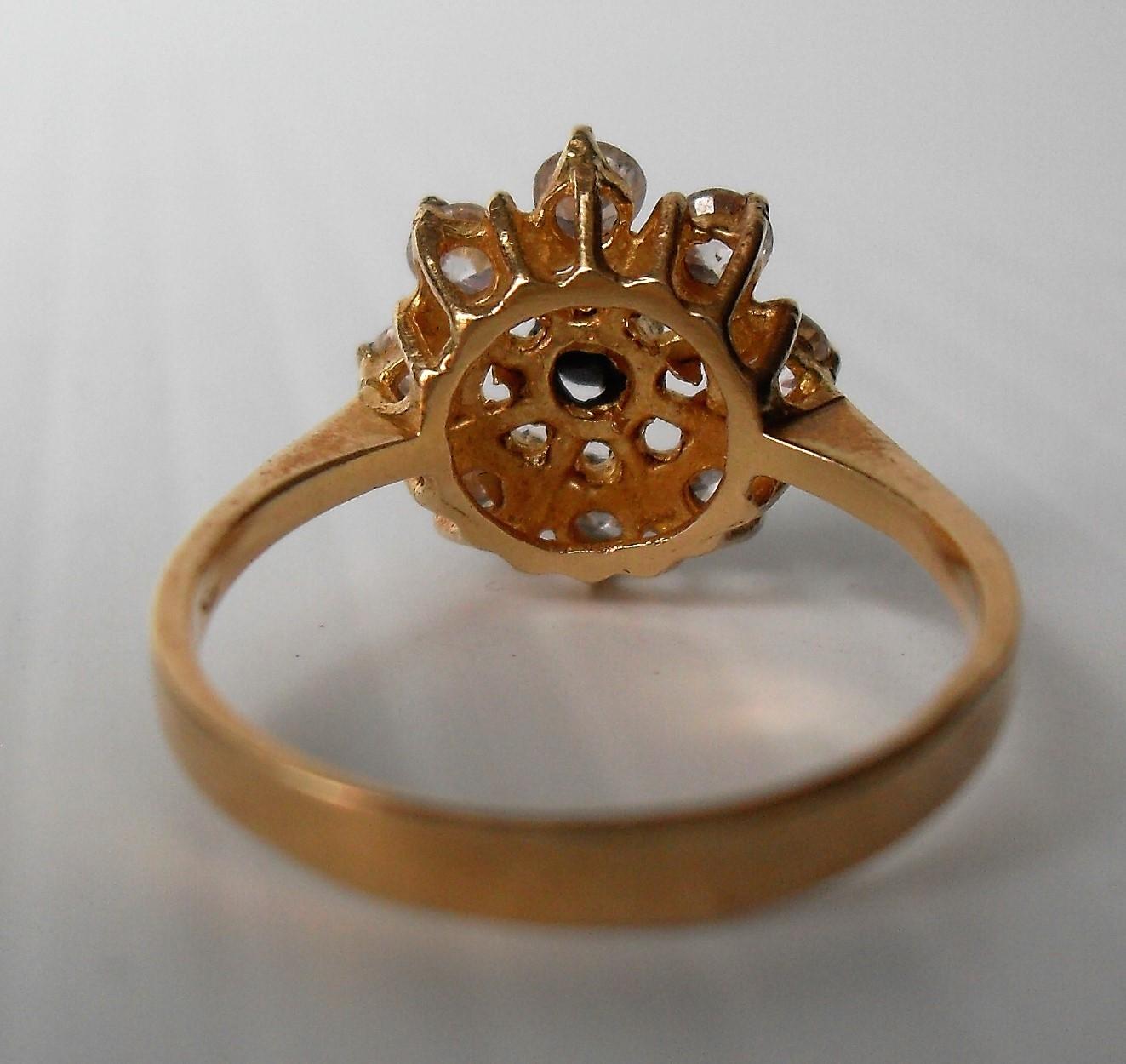 An 18ct yellow gold sapphire and diamond ring is a cage setting, 3.65g, size N (testing for 18ct - Image 2 of 3