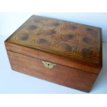 An oblong jewellery / collector's box with oyster veneer parquetry top, brass inlay and escutcheon