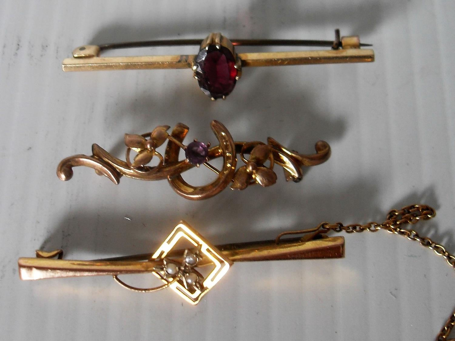 Three 9ct yellow gold bar brooches, two with amethyst stone decoration, the other with seed - Image 2 of 2