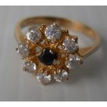 An 18ct yellow gold sapphire and diamond ring is a cage setting, 3.65g, size N (testing for 18ct