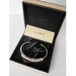 A Links of London boxed hallmarked silver open bangle and a London silver faceted bangle bracelet (