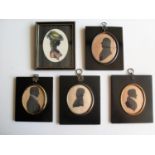 Three Victorian oval-framed silhouettes of gentlemen (8 x 7cm), one Edwardian colour silhouette of