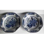 A pair of 18th century tin-glaze octagonal delftware plates painted with bowls of flowers and Daoist