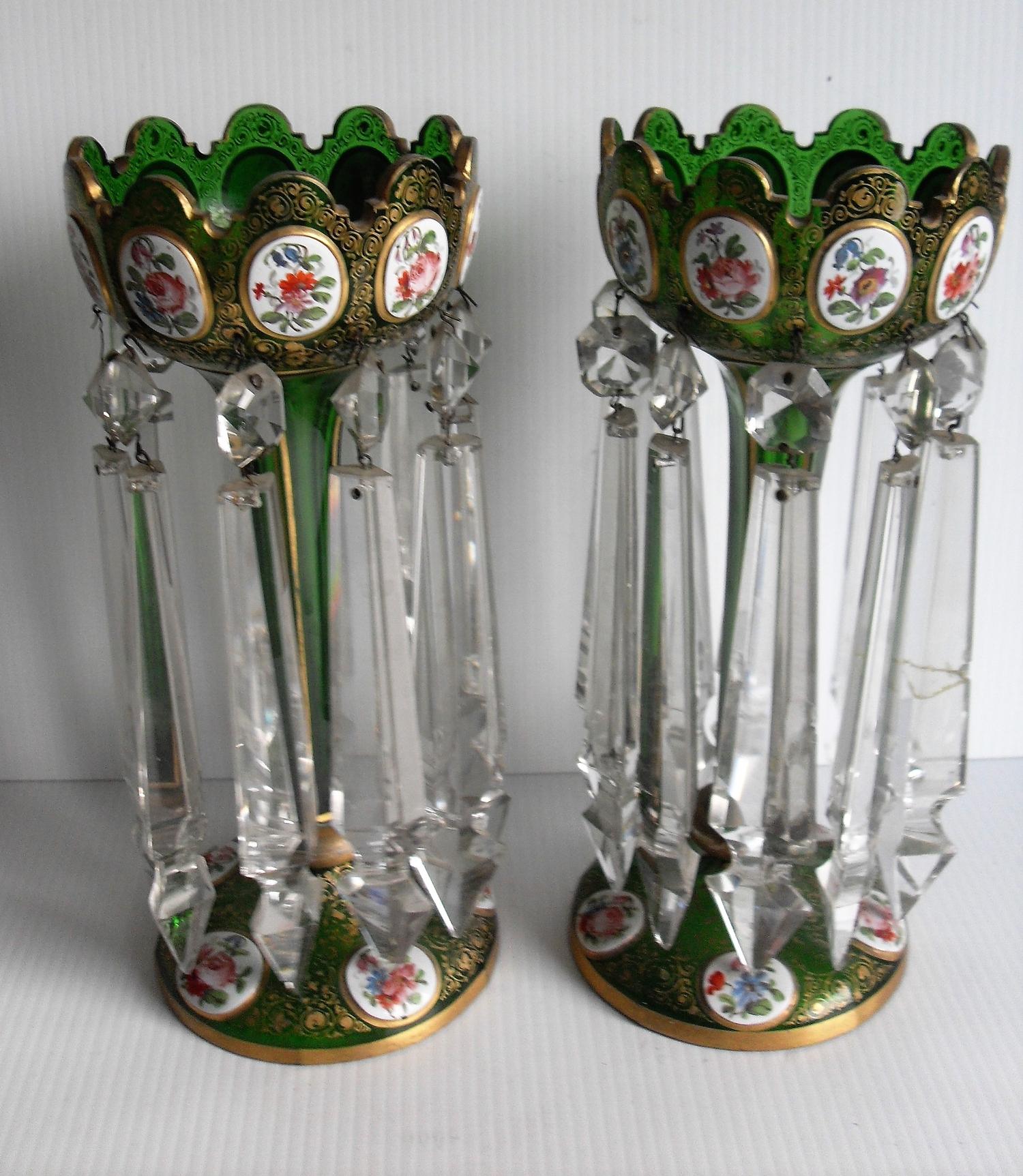 A pair of 19th century Bohemian overlaid green glass lustre vases decorated with oval medallions
