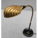 A vintage brass adjustable desk lamp with scallop-shaped shade, extending to 75 cm and a 19th