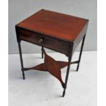 A Regency mahogany oblong side table with frieze drawer, circular brass handle, turned legs united